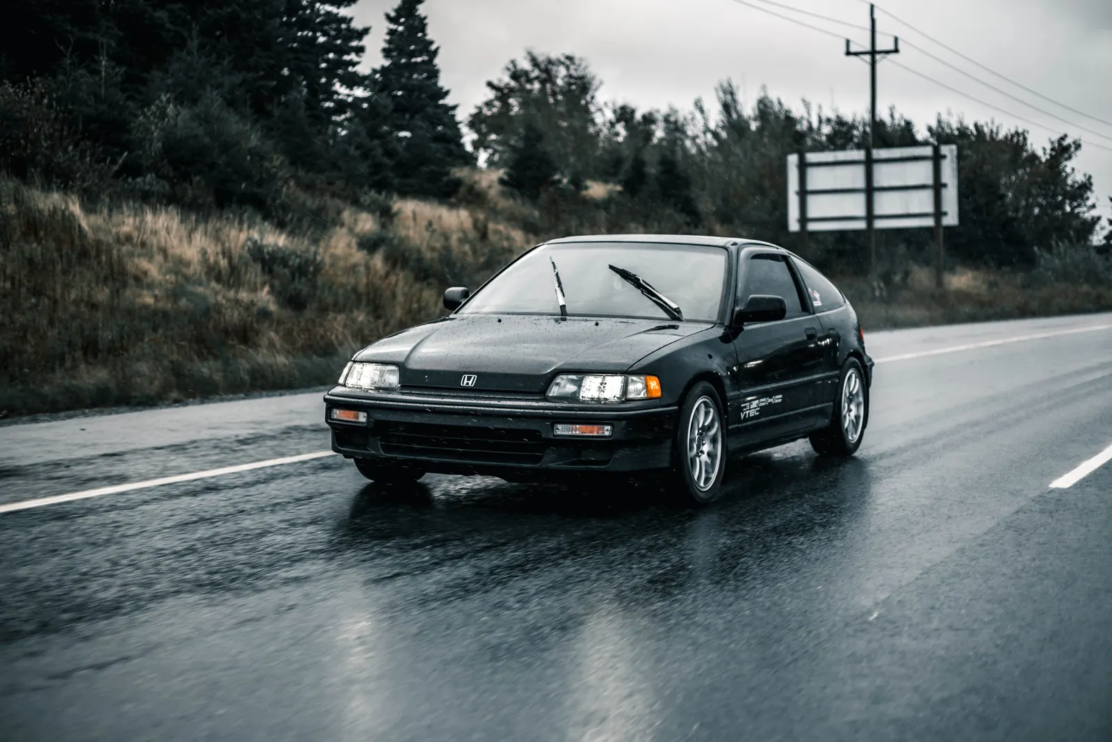 Car driving on a wet road in the rain