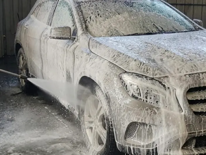 Mercedes-Benz GLA covered in foam at the wash bay